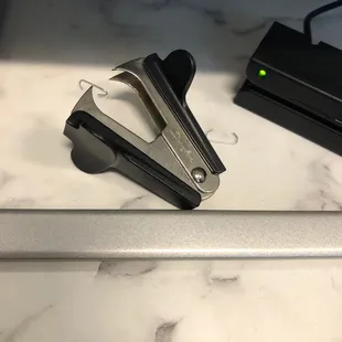 a stapler and stapler on a countertop