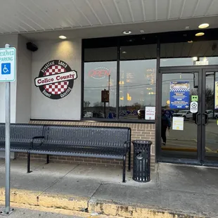 a bench in front of the restaurant