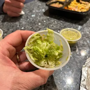 20% Guac 80% lettuce.  Scam