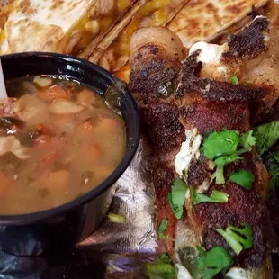 Grilled chicken quesadilla with borracho beans and side of bacon wrapped cream cheese jalapeños!