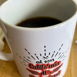 Cute coffee mugs with fresh coffee
