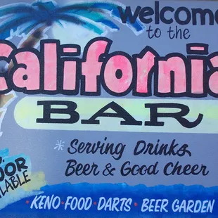 a sign for a bar with a palm tree