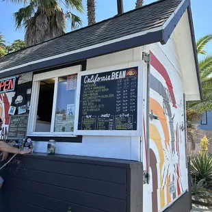 a man standing outside of a restaurant