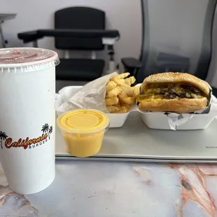 Triple cheese burger meals with a cup of cheese