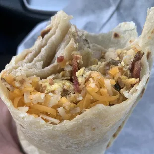 Bacon, egg, potato and cheese breakfast burrito
