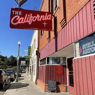 a sign for the california club