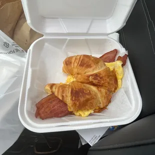 Bacon, eggs, cheese croissant sandwich