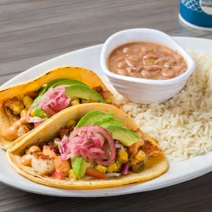 Mahi Mahi Taco Combo Cali-Style, grilled Mahi, tomato-cilantro mix, cilantro lime slaw, avocado corn salsa, chipotle aioli &amp; pickled onions.