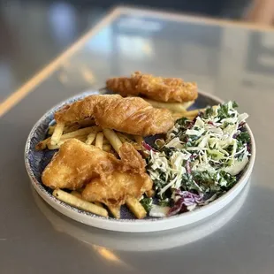 3 PIECE BATTERED FISH &amp; CHIPS: Crispy battered Swai filets over a bed of crispy French fries and a side of Kaleslaw | $12.95