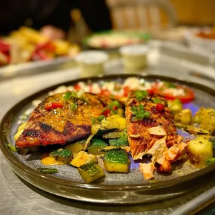 SOCKEYE SALMON* plate was very good. Zucchini was cooked perfectly and always love the SEASONED TOMATO &amp; FETA