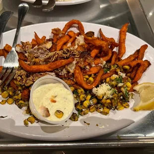 Catfish with cold corn and sweet potatoes.