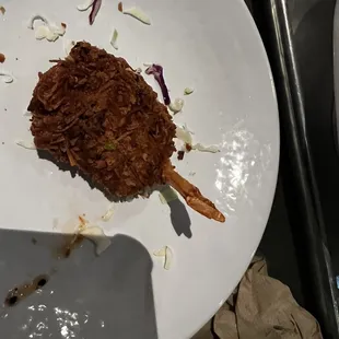Coconut shrimp as it&apos;s served.  Way over fried.