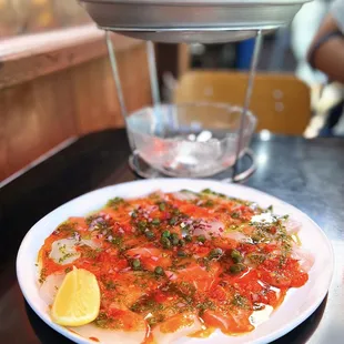 Combo Crudo Calabrese w/ halibut, scallops, salmon, olive oil, calabrian chili, capers, onions | $29