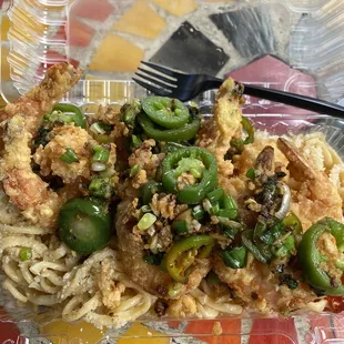 Salt and pepper prawns over garlic noodles