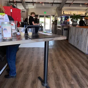 a woman standing at a counter