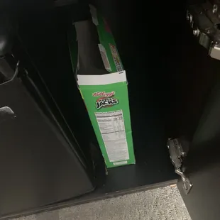Yo pen box of old apple jacks next to the fridge. Not sure how this was missed.