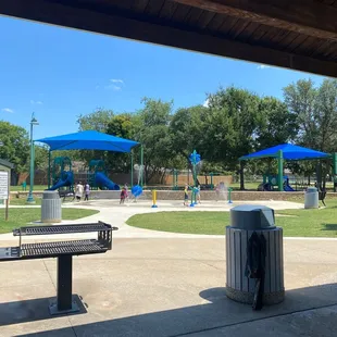 What a great little park! Has a splash pad, bathrooms, a pavilion, covered playgrounds, trash cans, a soccer field, and a basketball court.