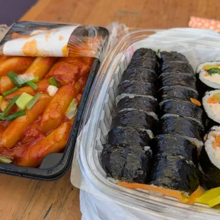 Tuna kimbap, next to dukbokki from the market