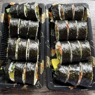 two trays of sushi