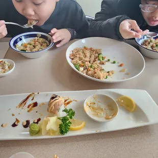 Chicken fried rice , seared salmon roll and seared salmon  My childrens love it.