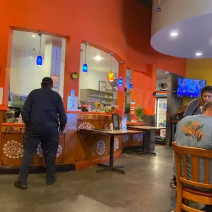 a man and a woman in a restaurant
