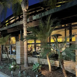 Exterior. An outdoor patio sits right along the windows and has heating posts.