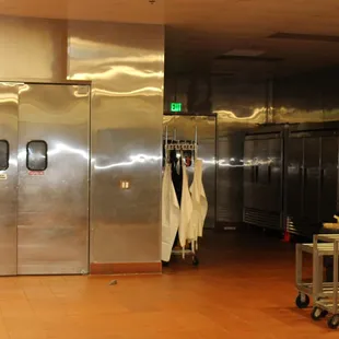 a commercial kitchen with stainless steel cabinets