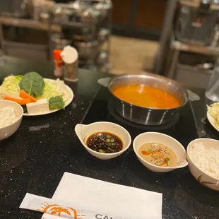 various bowls of food on a counter