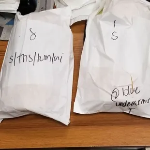 two bags of food on a desk
