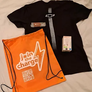 Swag! Drawstring bag and 60W LED bulb from SMUD, T shirt from Chevrolet, and leather keychain from Toyota.