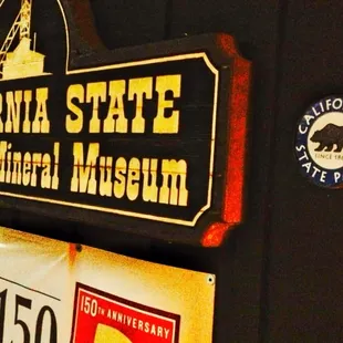 Sign to left of entrance.