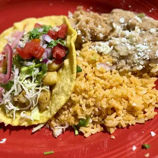 In-house made corn tortilla fish tacos with fresh shredded cabbage and pickled onion from the salsa bar