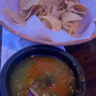 Chips and salsa  green and red mixed with cilantro !  Chips are nice and fresh !!