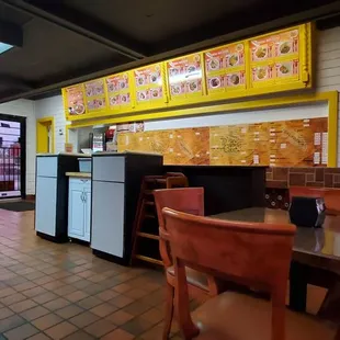 a kitchen with a table and chairs