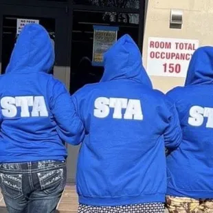 Teachers in their sweatshirts