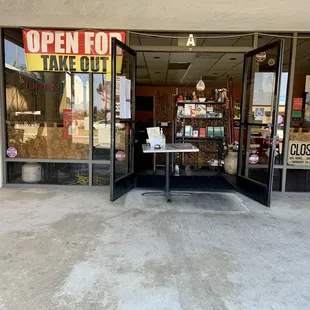 Outside: order and pickup at the table set up at the entrance