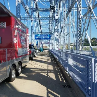a red firetruck on a bridge