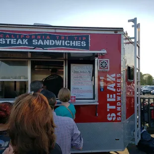 people ordering food from a food truck