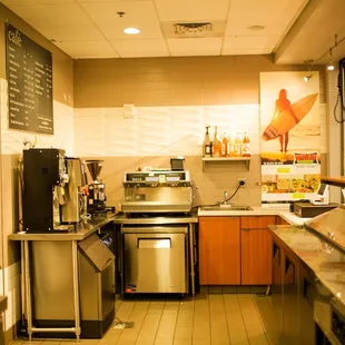a restaurant kitchen with stainless steel appliances