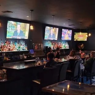 people sitting at the bar