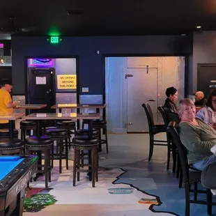 a pool table in the middle of the room