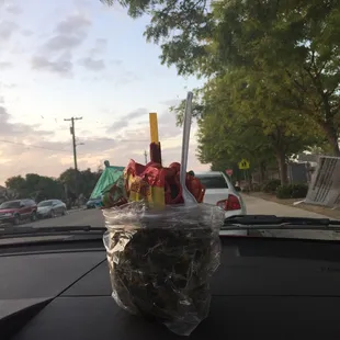 a plastic cup filled with snacks