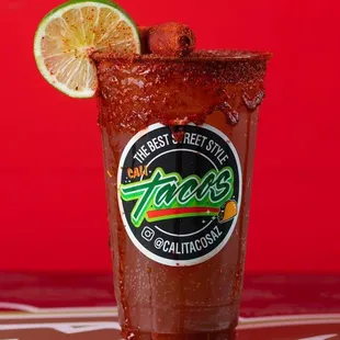 a bloody drink with a slice of lime