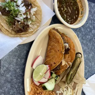 Quesadilla, roasted jalapeño, rice, beans and side of soup. Shredded beef taco with lime, slices of radishes, onion and cilantro.