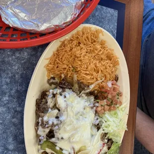 Fajitas shredded beef, flour tortillas, green pepper, onion, lettuce, sliced radishes and topped with cheese.