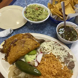 Queso birria platter, chips and guacamole