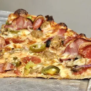 The last couple of slices of an extra large supreme + Jalapeños it was perfection