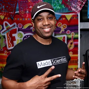 a man in a t - shirt and cap