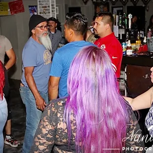 a group of people at a bar