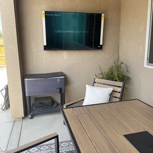 58" tv mounted and added an electrical outlet behind the TV